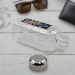 Transparent plastic mukhwas bottle with steel cap on white background