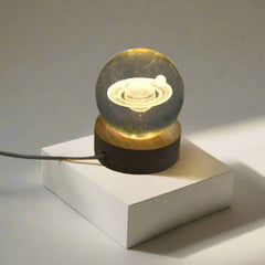 Astronaut Crystal Ball Night Light on a rustic wooden base.