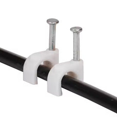 Close-up of plastic U-shaped 8mm nail cable clips with steel nails