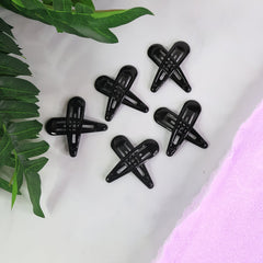 Matte finish metal hair clips arranged in pastel and bold shades