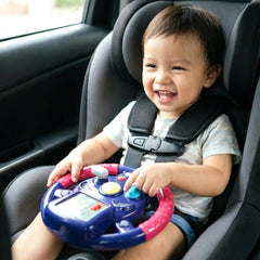 Close-up of child-friendly steering wheel toy featuring bright lights