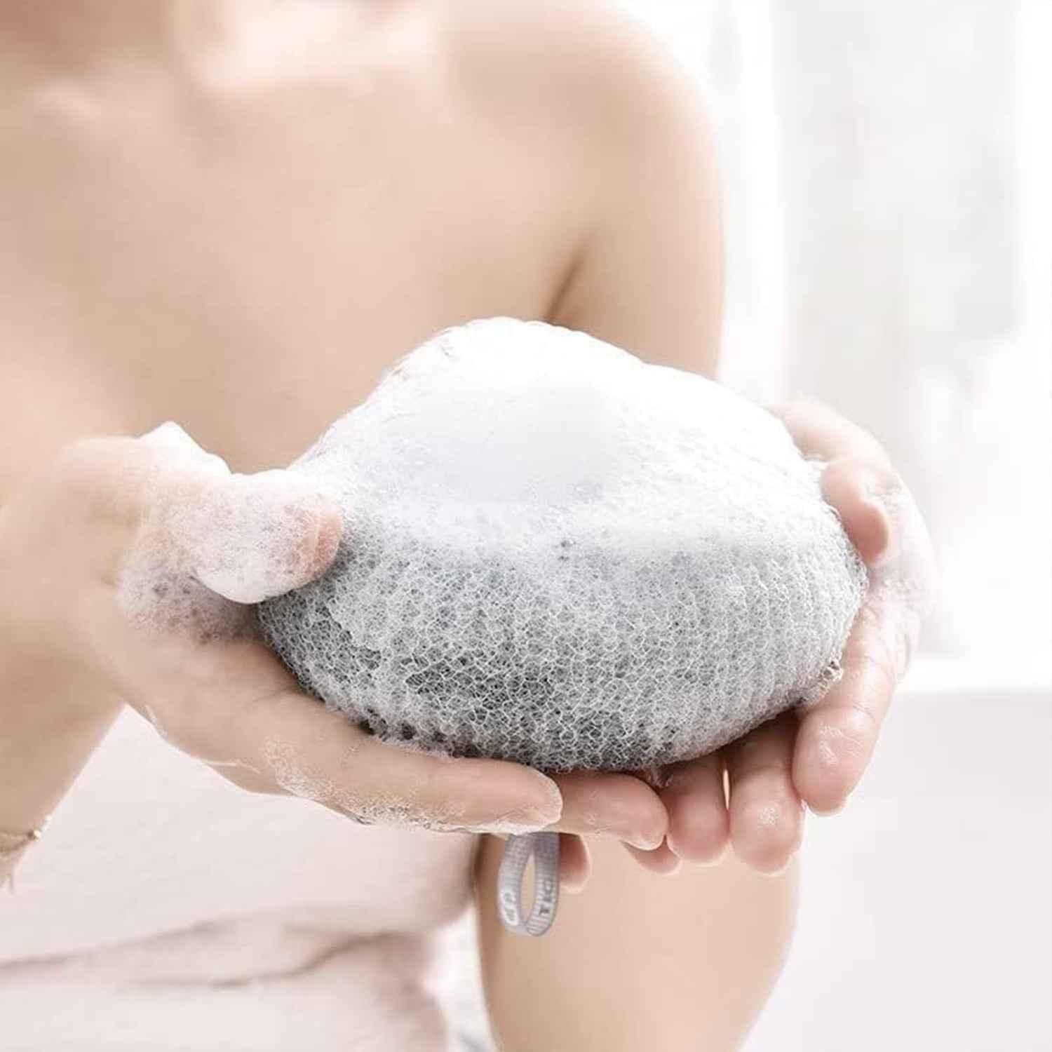 Detailed view of the super soft texture of the flower bath sponge.
