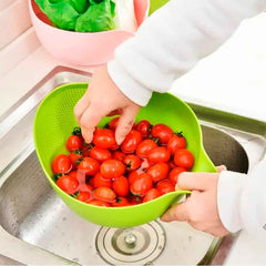 A Quickslice rice washing bowl with a thick drain basket and handle, perfect for kitchen use.
