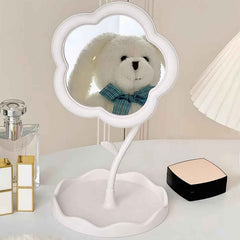 Hand adjusting the angle of the rotatable flower makeup mirror