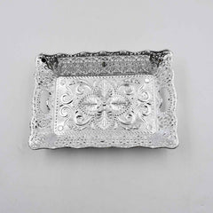 Decorative mukhwas serving tray beautifully arranged on a modern dining table.