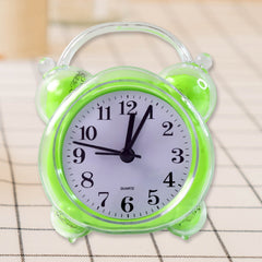 Close-up of quartz alarm clock white dial with bold black numerals