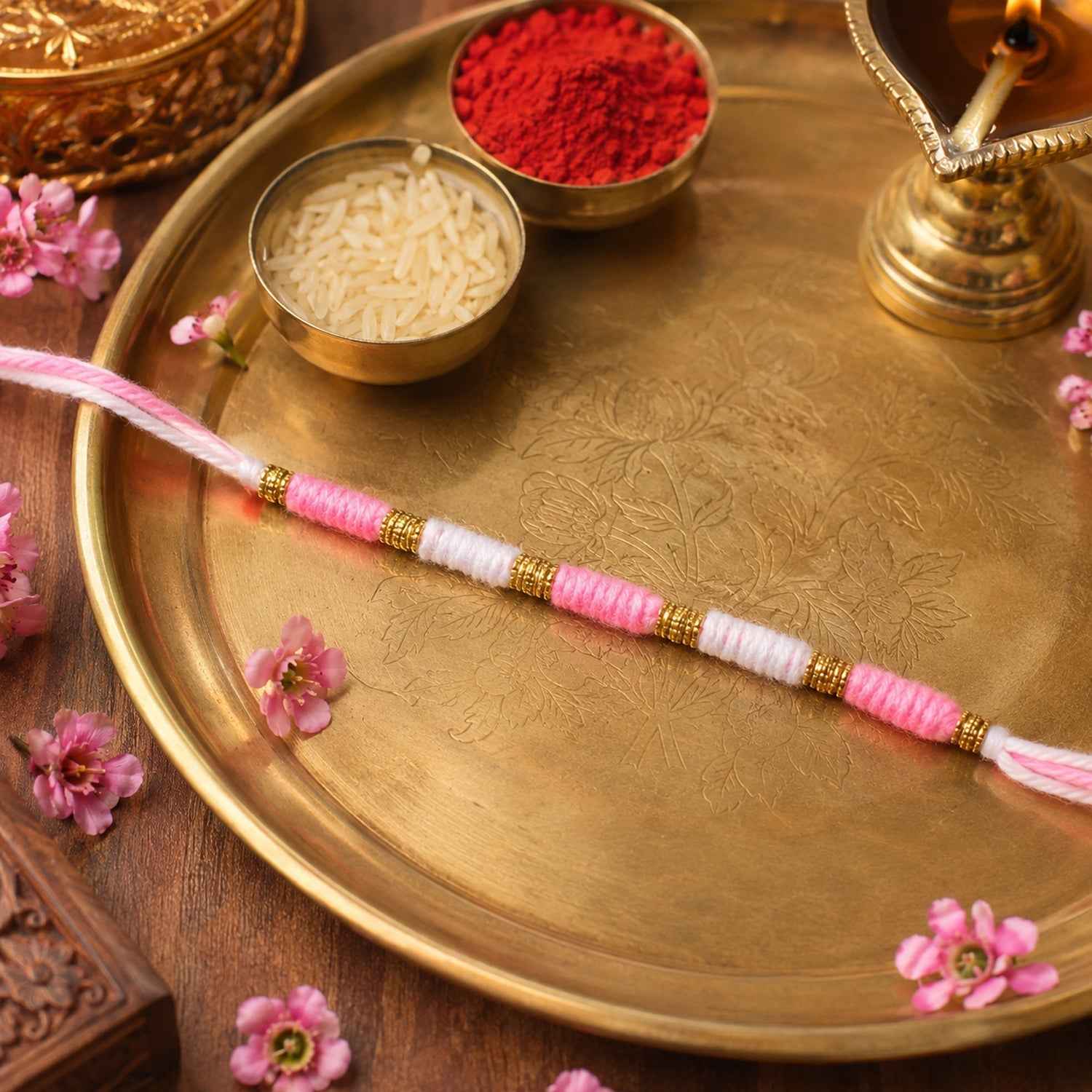 Pink & White Thread Rakhi Ð Elegant Traditional Beaded Design