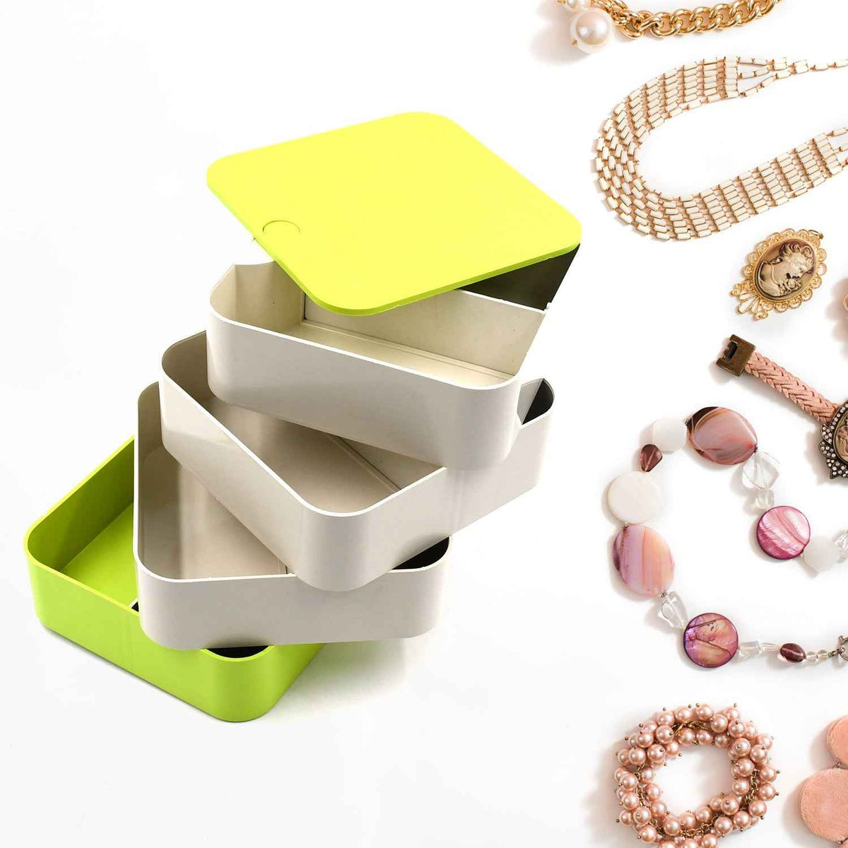 Elegant 4-layer Rotating Jewelry Box in white, ideal for storing earrings and rings.