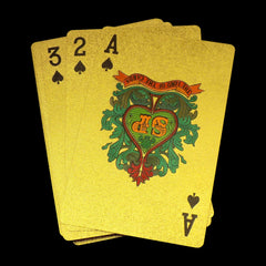 Close-up of elegant gold poker cards showcasing their premium finish.