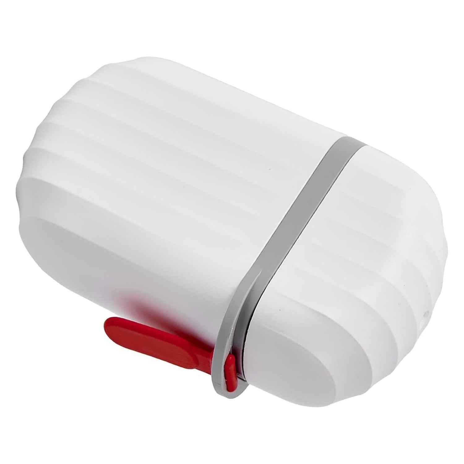 VelvetBubbles travel soap case next to a ruler, showing its compact size for travel.