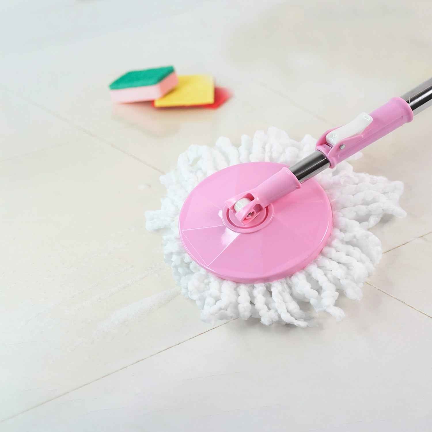 360° rotating mop head effortlessly cleaning a tiled floor surface.