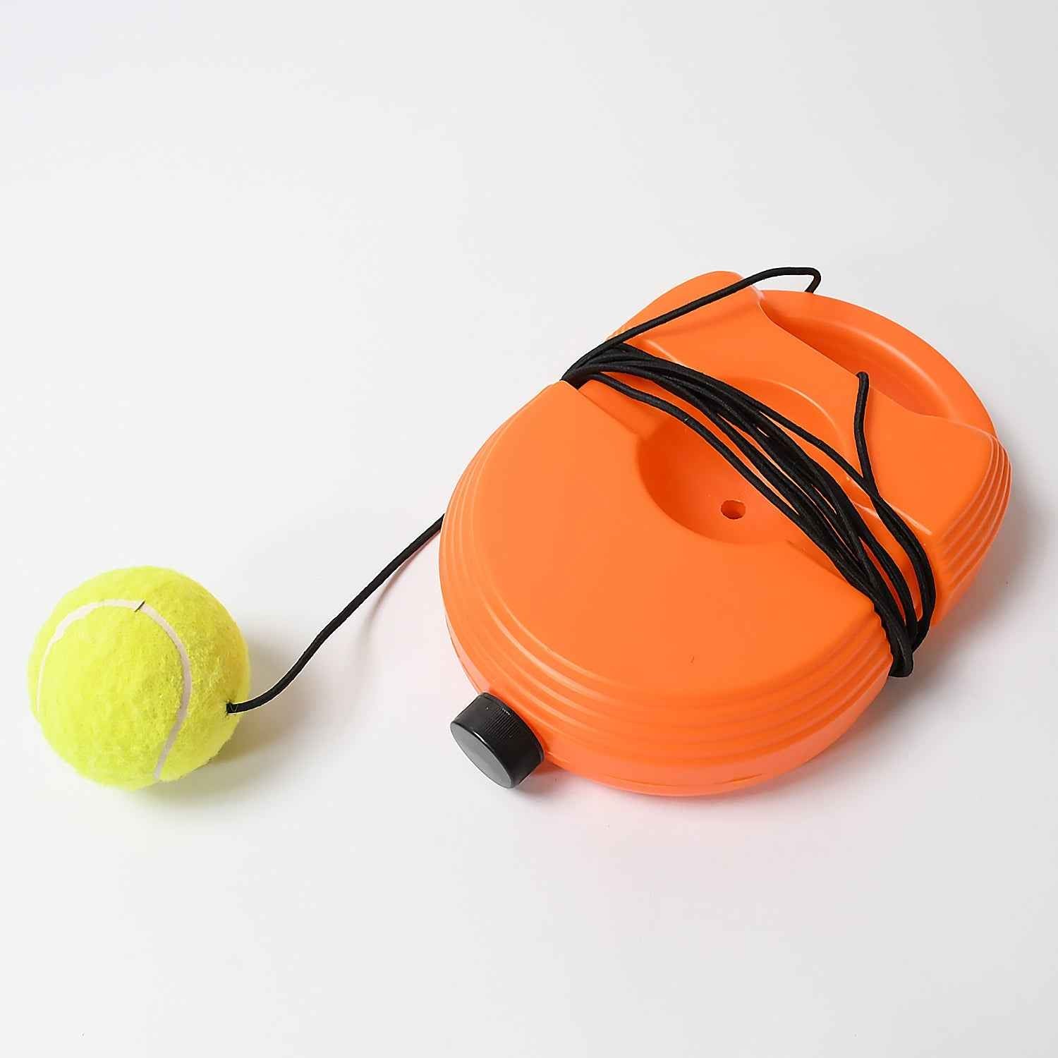 Person practicing with the Tennis Rebound Trainer on a tennis court.