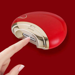 Electric nail clipper showing USB charging port and cleaning brush included