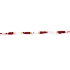 Red and white Mauli Rakhi with gold wire for traditional celebrations