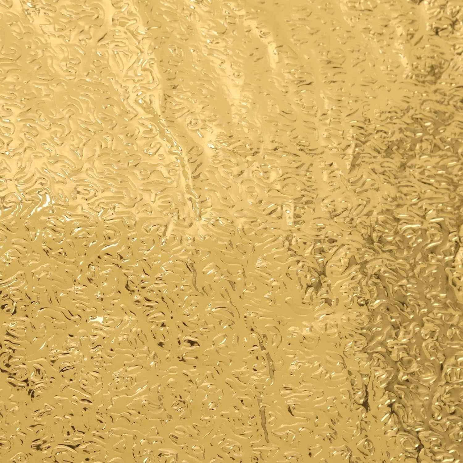 Close-up of a self-adhesive golden kitchen foil sticker roll.