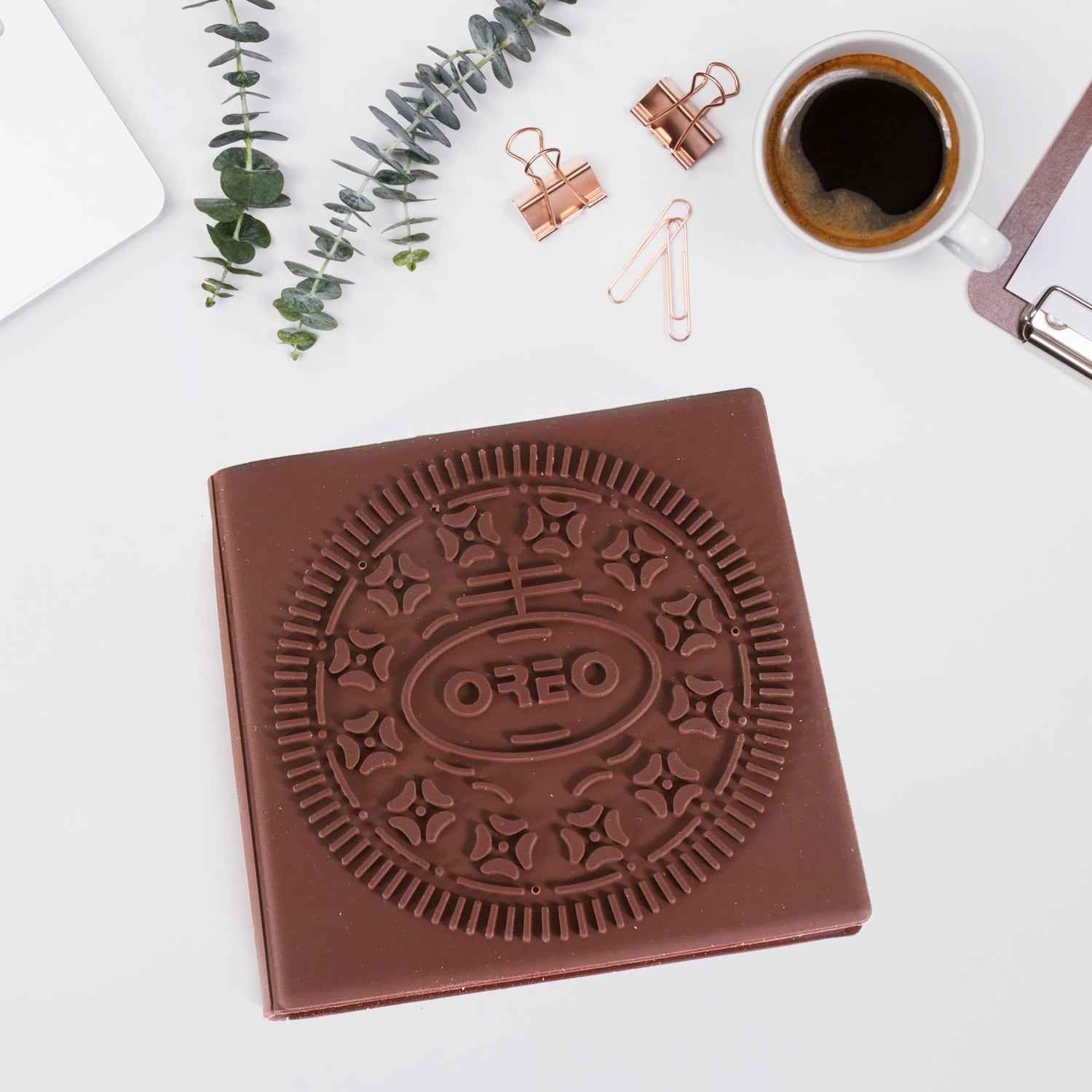 Open chocolate scented notebook displaying blank pages for writing.