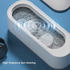 High-frequency vibration ultrasonic cleaning device with a lid open.