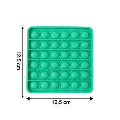Close-up of popping bubbles on silicone Pop It toy