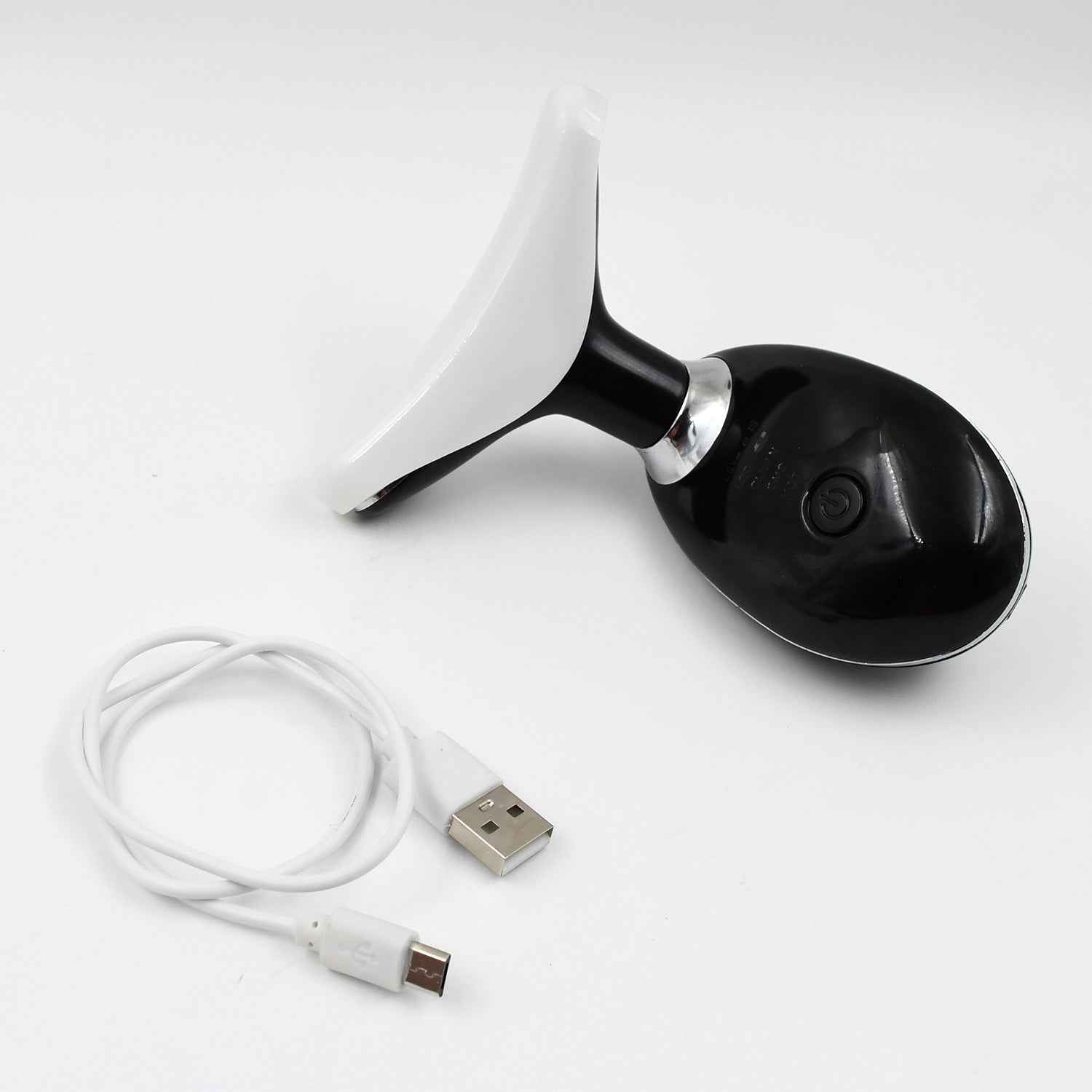 The portable Neck Face Massager shown with its USB charging cable.