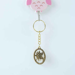 Maa Durga Golden Oval Frame Keychain – Spiritual Protection