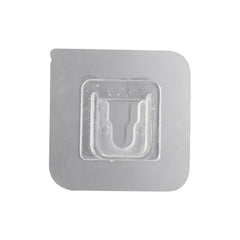 Transparent self-adhesive wall hook ready for easy peel-and-stick application.