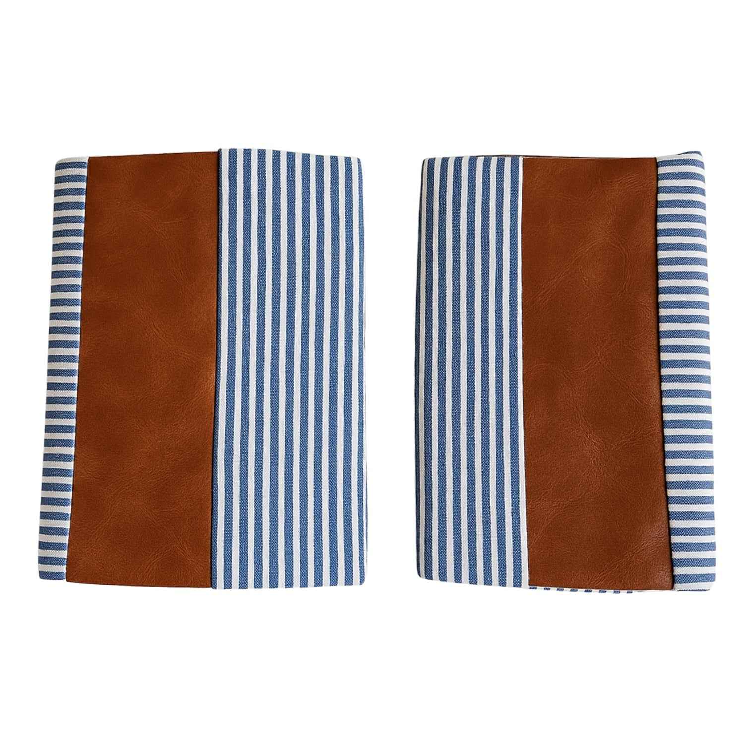 Pair of leather and cotton pillow covers on a modern sofa