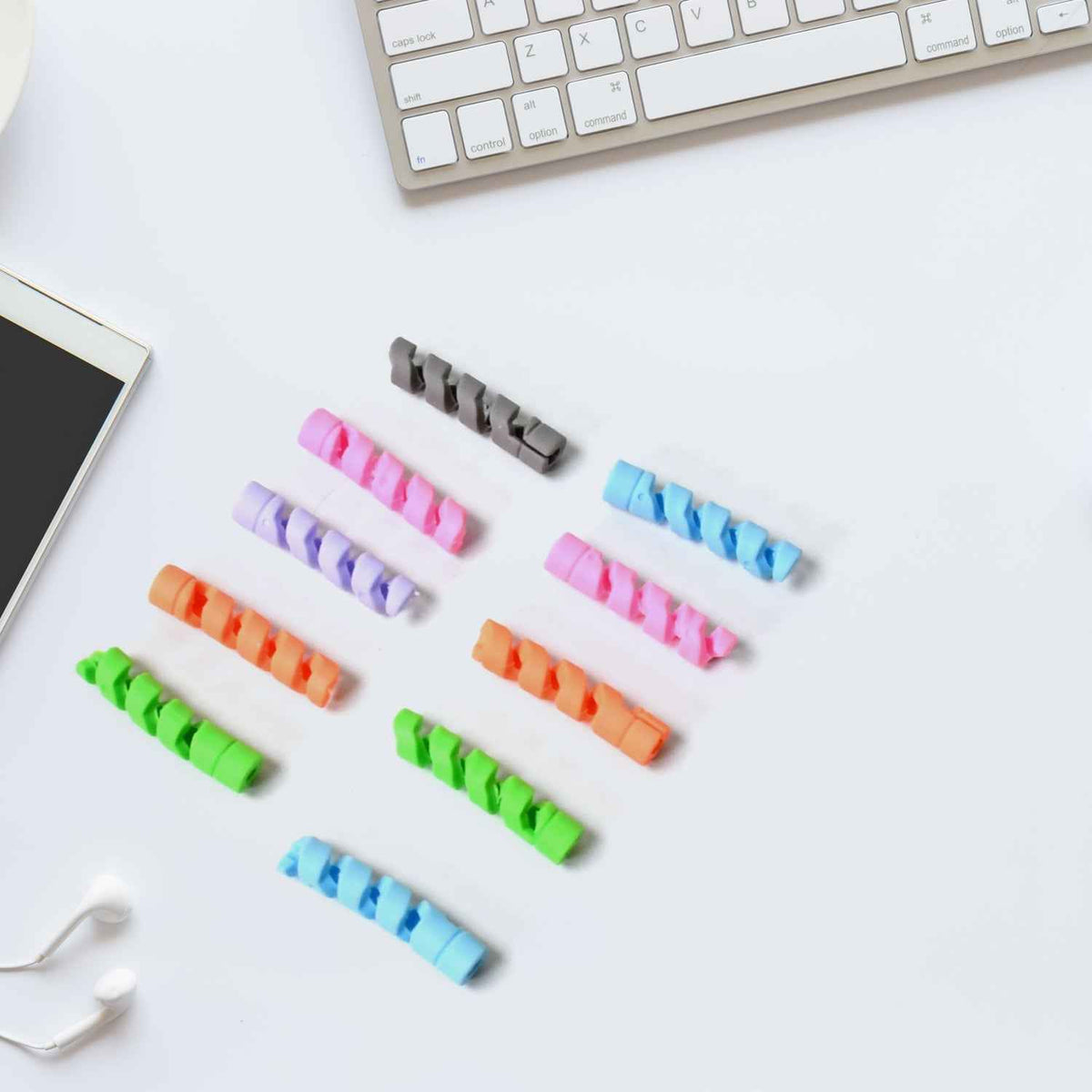 Flexible cable protector wrapped around a white earphone cable.