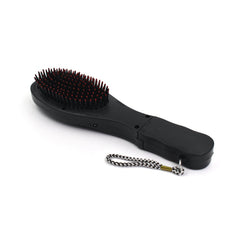User holding the electric hair massager comb for a relaxing scalp massage.