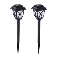 FitFuzion solar pathway lights casting bright, artistic patterns on a dark garden path, enhancing outdoor decor.