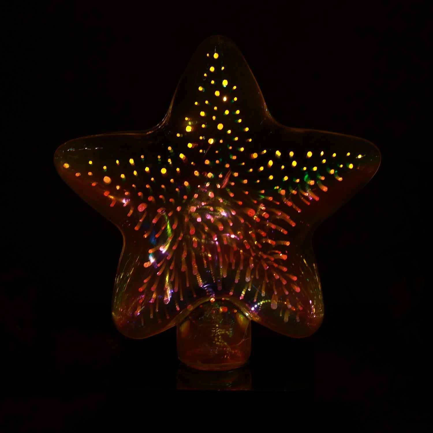 Star shape 3D illusion night lamp illuminating vibrant colors in a dark room