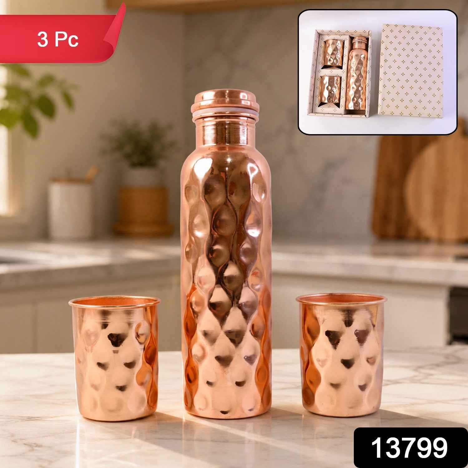 The elegant copper water bottle and two glasses, presented as a thoughtful gift set.