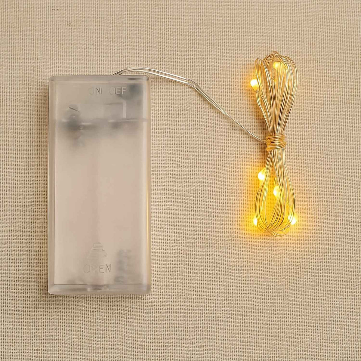 Copper wire string fairy lights with warm white 30 LED bulbs glowing beautifully.