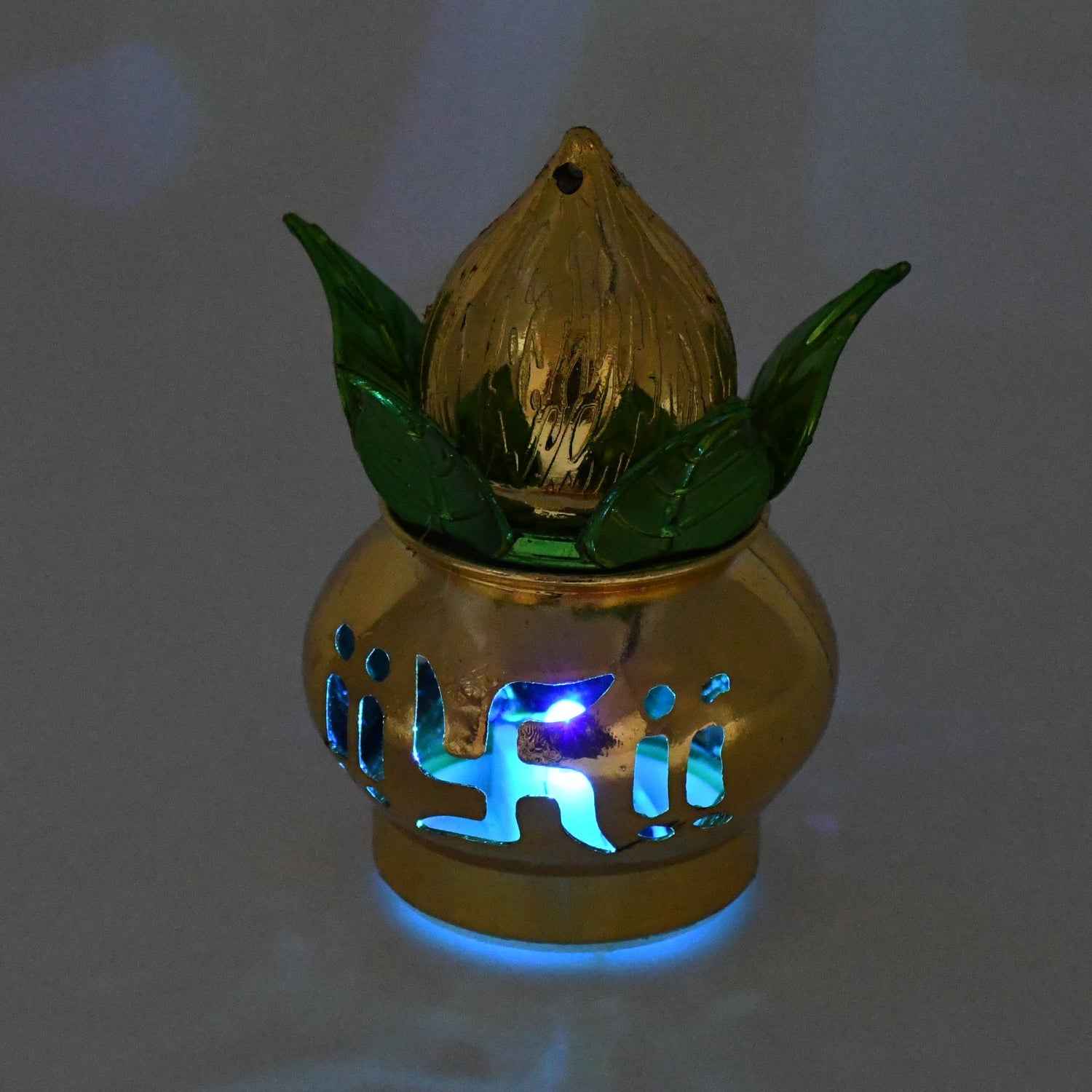 A single gold LED Kalash illuminating a Pooja Mandir setting with a gentle glow.
