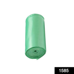 Stack of green eco-friendly garbage bag rolls for daily waste management.