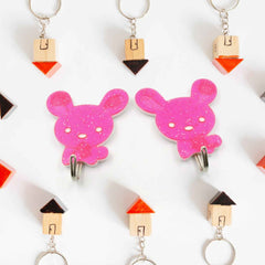 Pack of two strong self-adhesive hooks for versatile home organisation.