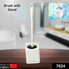 Sleek white toilet brush holder keeps the brush discreetly stored.