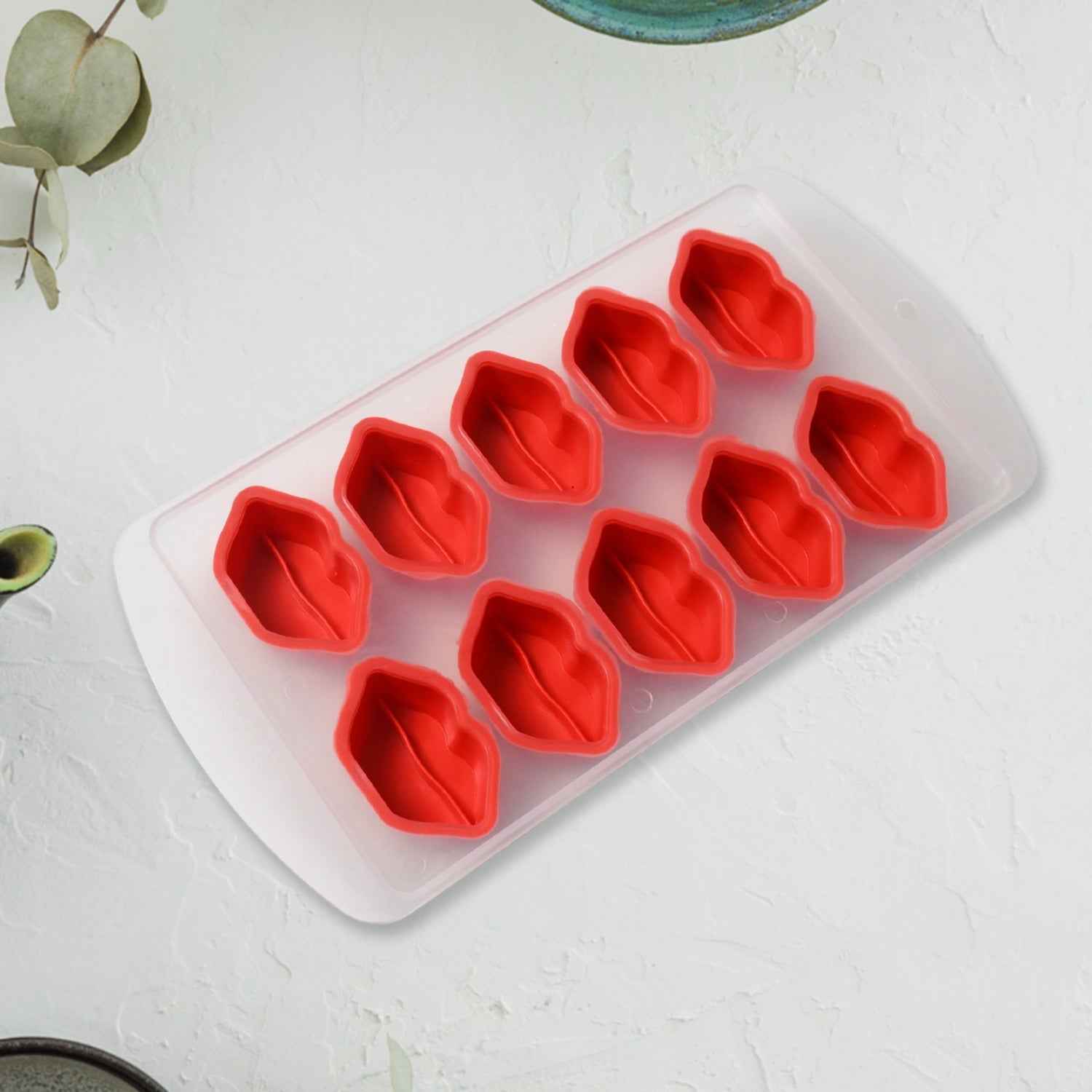 Closeup of a flexible silicone ice tray showing intricate fruit designs.