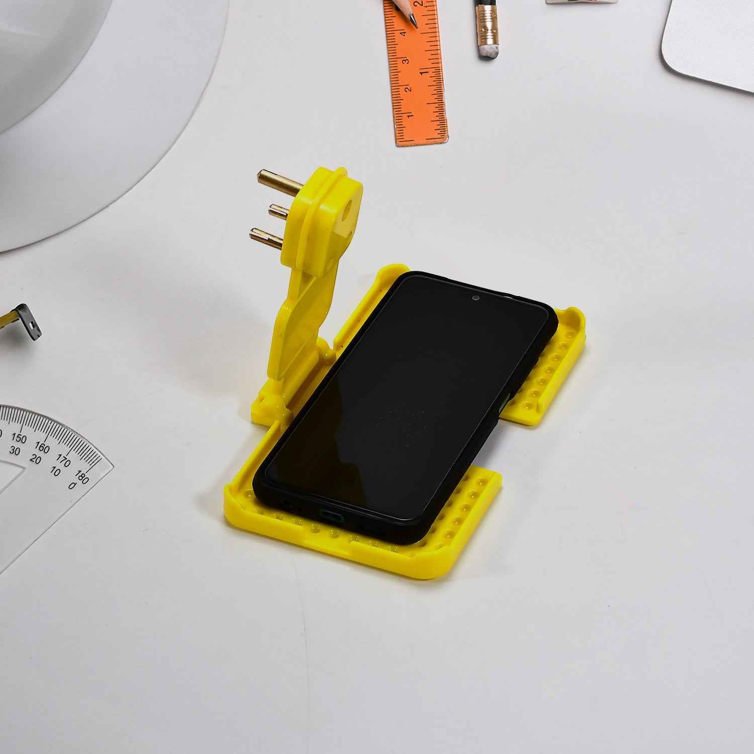 Side angle of the multi-purpose mobile charging wall holder with ventilation slots.