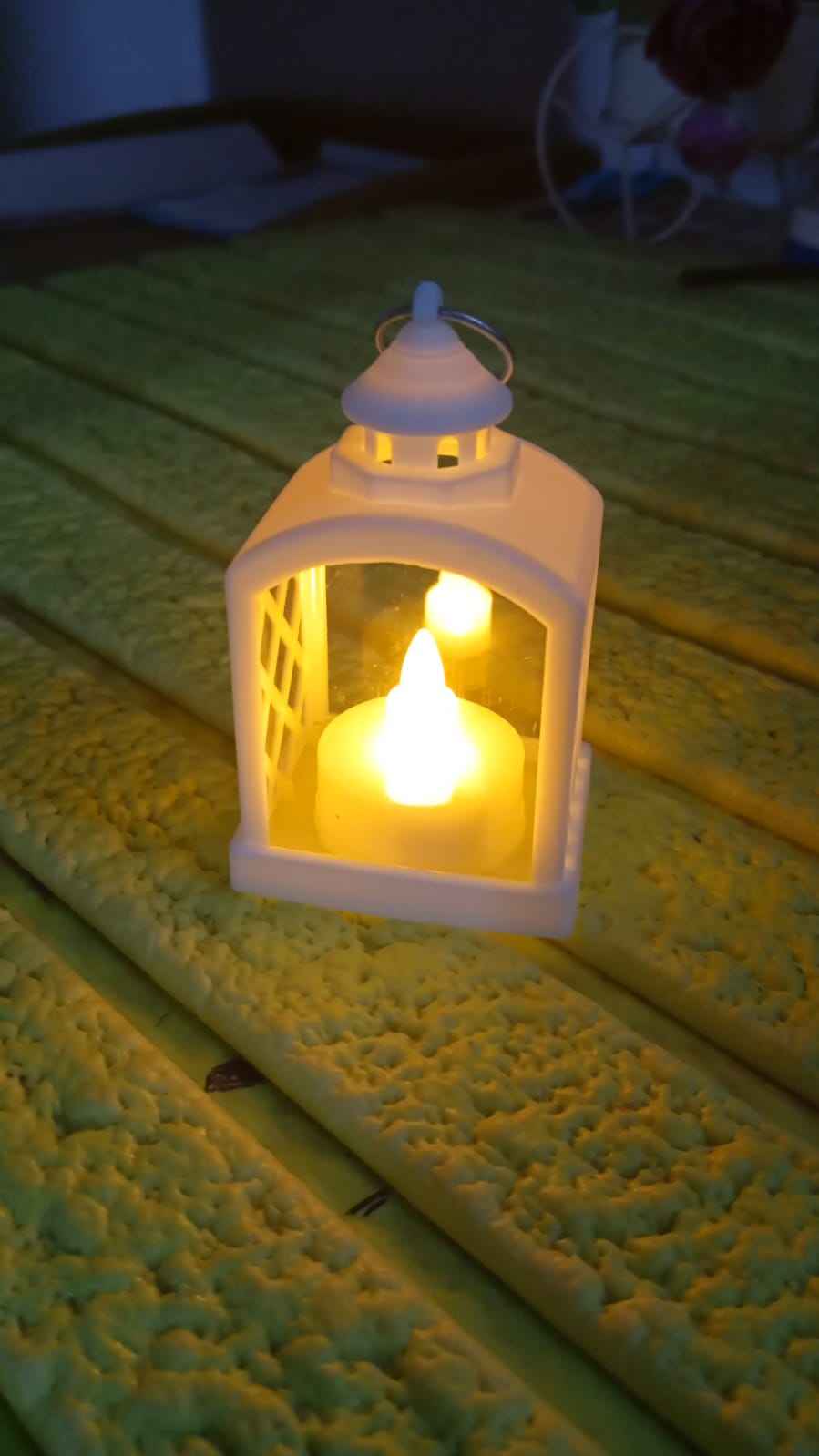 Arrangement of multiple flameless LED lanterns for a festive ambiance.