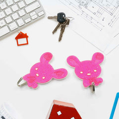 Stylish and waterproof self-adhesive hooks mounted on a kitchen wall.
