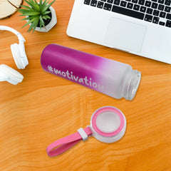 Close-up view of the colorful, inspiring design on the glass water bottle.