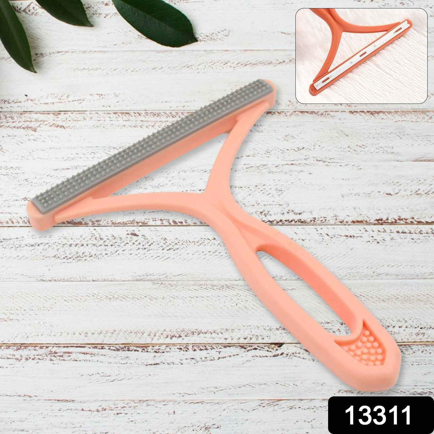 Compact double-sided lint brush, ideal for travel and quick clean-ups.