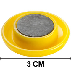 Collection of colorful circular board magnets on a flat surface.