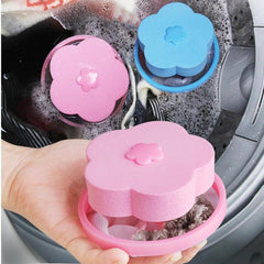 Floating washing machine lint catcher with a pink flower detail.
