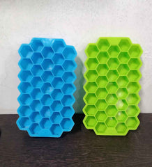 Colorful silicone ice cube tray with honeycomb design for easy release.