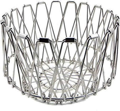 Multipurpose stainless steel wire basket transformed into a stylish fruit bowl for dining.