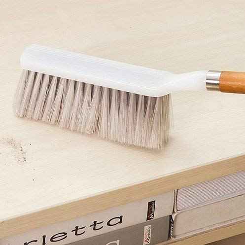 A durable household cleaning brush with a wooden handle, ideal for versatile dusting tasks.
