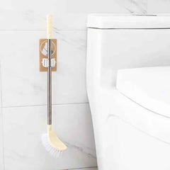 The self-adhesive mop holder demonstrating easy installation on a smooth surface.