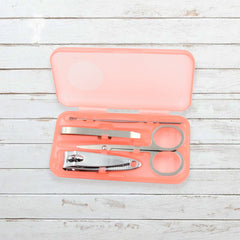 AuriGlam portable nail clipper set in its clear plastic travel case.