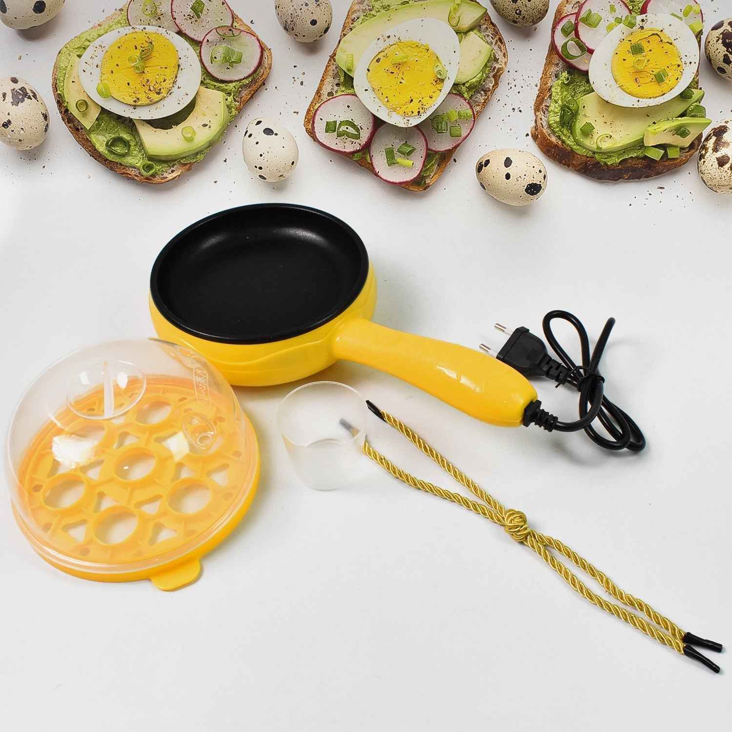 Close-up of the non-stick frying pan surface and egg boiling tray of the electric cooker.